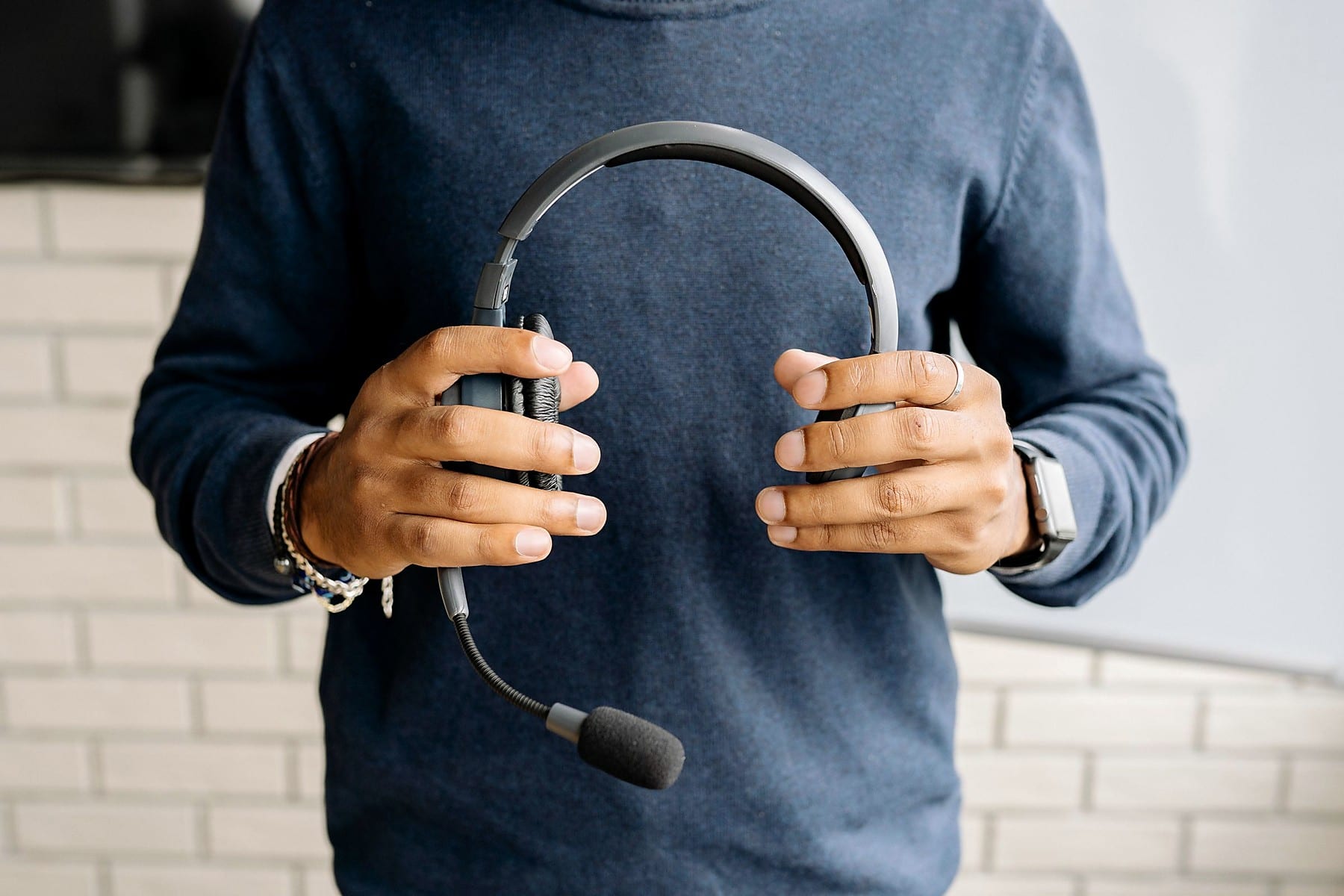A customer-support professional using a communications headset
